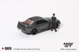 2025 MINI GT #869 Nissan Skyline GT-R (R32) Gunmetal W/ Matsuda Figure Tsugio Matsuda Collection